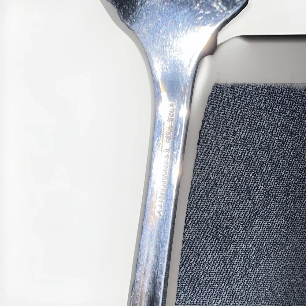 Oneida Community Royal Flute pierced pie server in stainless steel. 9.5”
